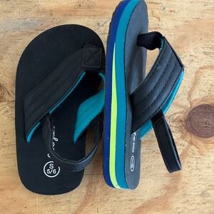 Black and Blue Flip Flops with Green Stripe